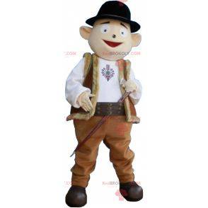 Schneemann-Maskottchen im Hirten-Outfit mit Melone -