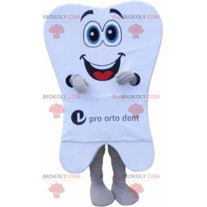 Mascota de diente blanco gigante con una gran sonrisa -