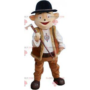 Snowman mascot in mountain outfit with bowler hat -