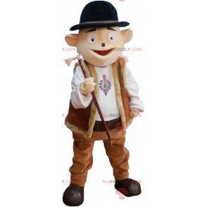 Mascote do boneco de neve com roupa de montanha e chapéu-coco -