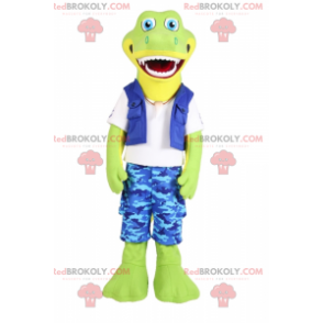 Mascote crocodilo sorridente com shorts camuflados azuis -