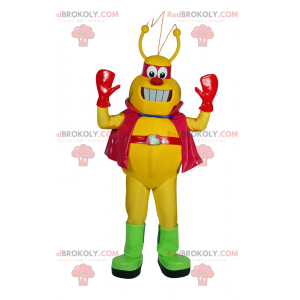 Mascote alienígena amarelo com capa - Redbrokoly.com