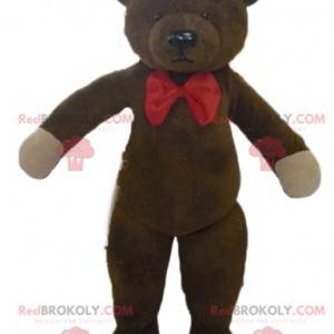 Mascota del oso de peluche marrón con una pajarita roja -