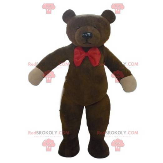 Mascotte de nounours marron avec un nœud de papillon rouge -