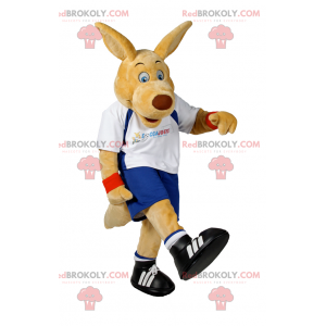 Beige hundmaskot i fotbollsutrustning - Redbrokoly.com
