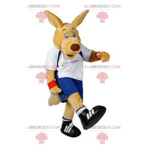 Beżowy pies maskotka w stroju piłkarskim - Redbrokoly.com