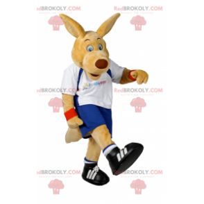 Beżowy pies maskotka w stroju piłkarskim - Redbrokoly.com