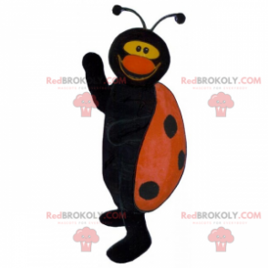 Lieveheersbeestje mascotte zwart en rood glimlachen -