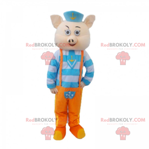 Schweinemaskottchen im blauen und orange Matrosenoutfit -