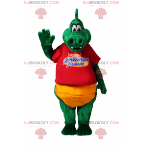 Mascotte coccodrillo verde con una maglietta rossa -