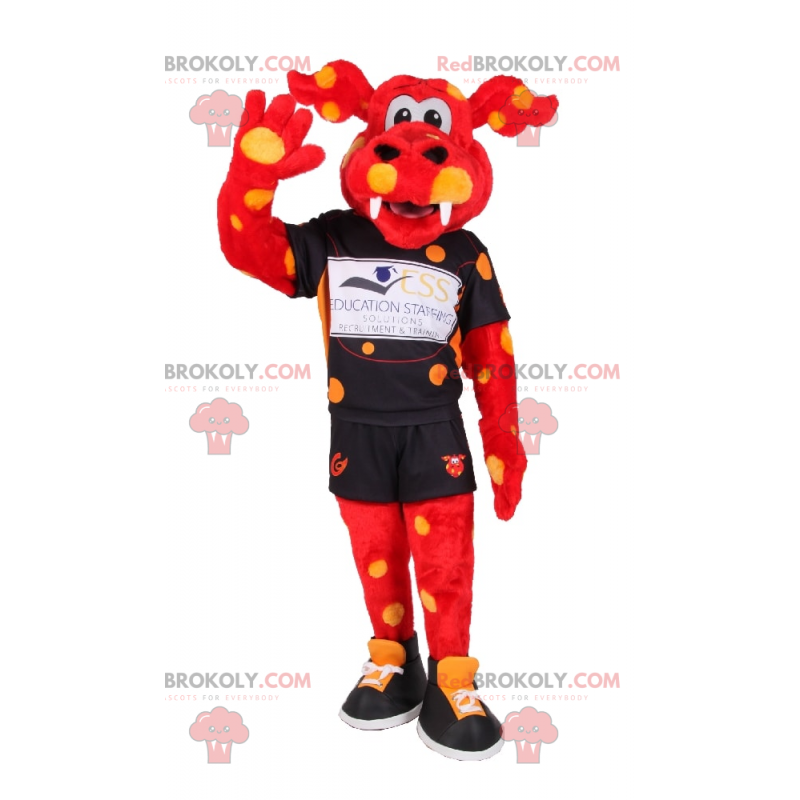 Mascotte de dragon orange et tache jaune en tenue de sport -