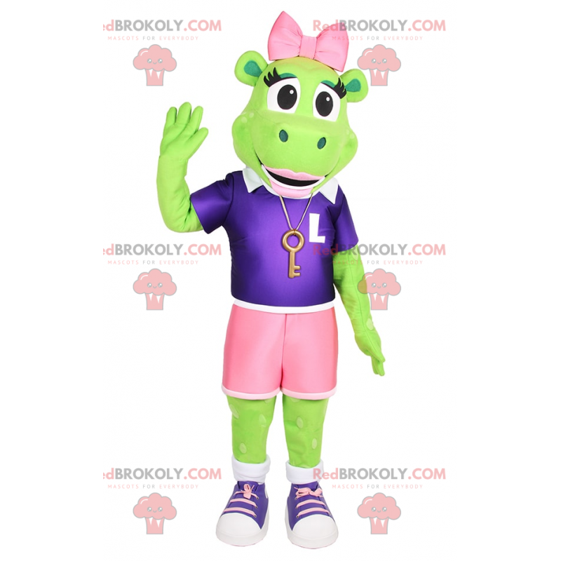 Froschmaskottchen mit rosa Schleife und sportlichem Outfit -