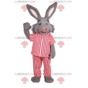 Kaninchenmaskottchen mit großen Ohren und gestreiftem Pyjama -