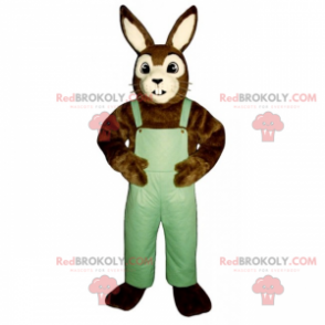 Braunes und weißes Kaninchenmaskottchen mit Overalls -