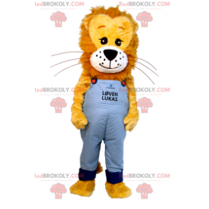 Mascota del león con melena peluda y overol azul -