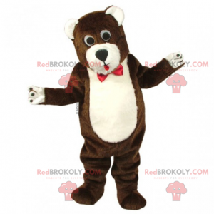 Mascota de oso de peluche marrón y blanco con lazo -