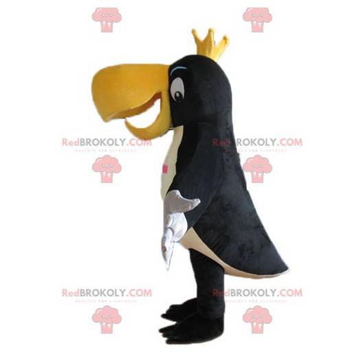 Mascotte de toucan noir blanc et jaune avec une couronne -