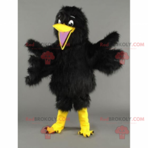 Mascotte de petit oiseau au plumage doux et noir -