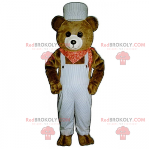 Maskottchen kleiner Braunbär mit Overall und Kopftuch -