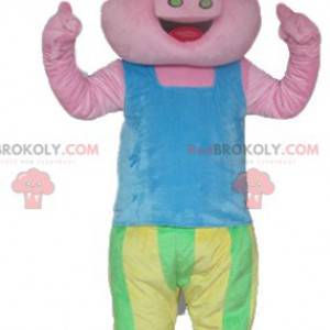 Pink pig mascot in blue green and yellow outfit - Redbrokoly.com