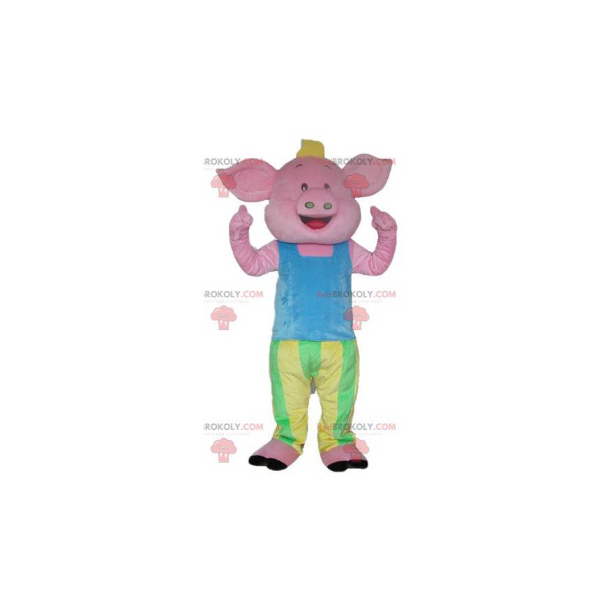 Mascote porco rosa em traje azul verde e amarelo -