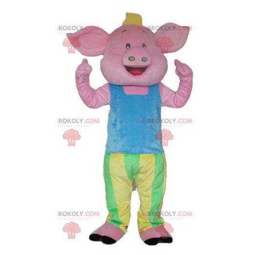 Mascotte maiale rosa in abito blu verde e giallo -
