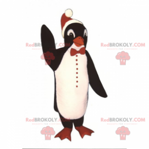 Mascota de pingüino con sombrero de Navidad - Redbrokoly.com