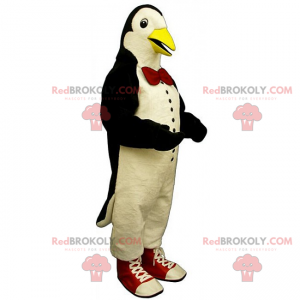 Mascota de pingüino con pajarita y zapatillas - Redbrokoly.com