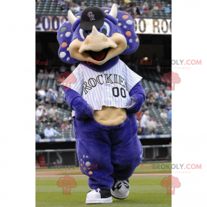 Mascota de rinoceronte púrpura en ropa deportiva -