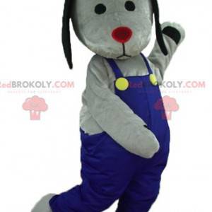 Grijze en zwarte hond mascotte met blauwe overall -