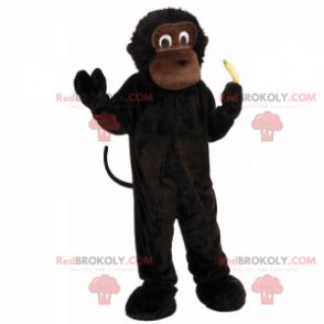 Mascote macaco preto com sua pequena banana - Redbrokoly.com