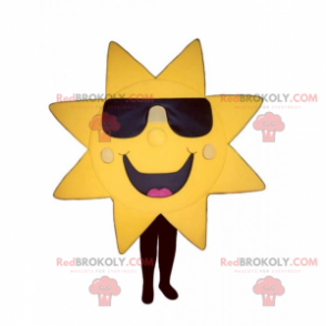 Mascota de sol con gafas oscuras y gran sonrisa - Redbrokoly.com