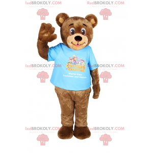 Mascota de oso de peluche sonriente con camiseta -