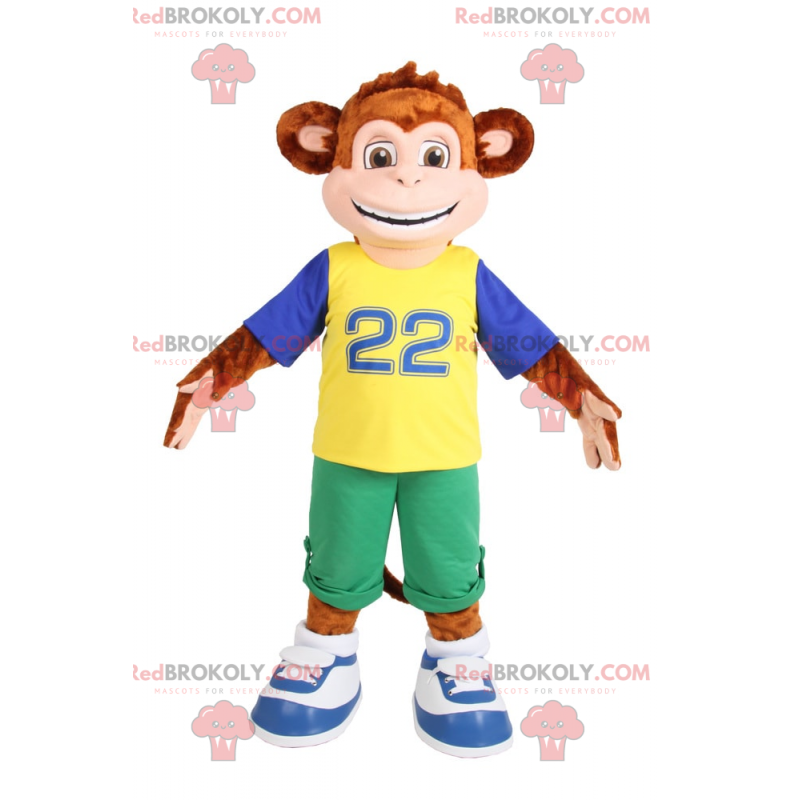 Mascot lille abe smilende i grønne Bermuda shorts -