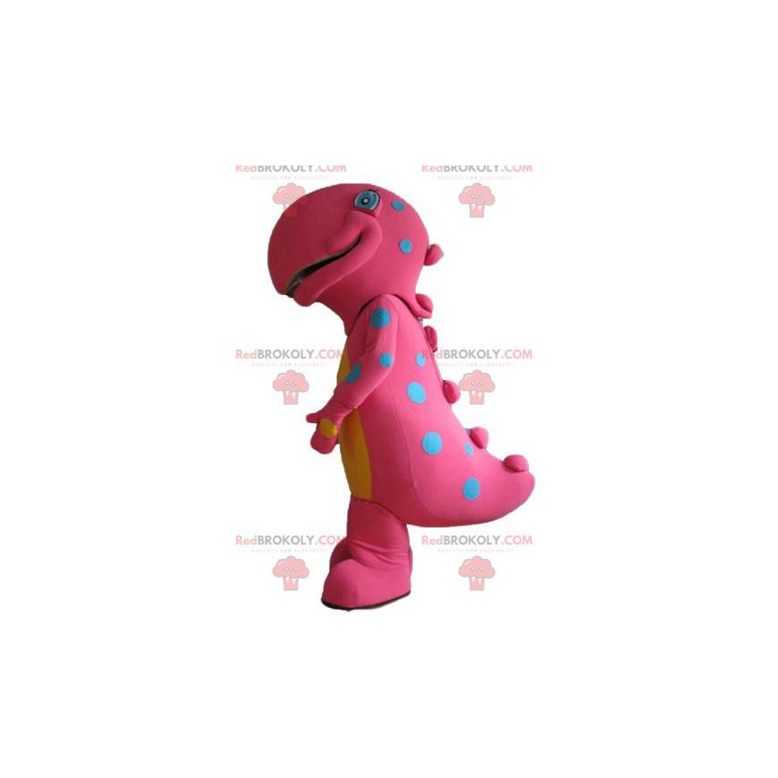 Grande mascote de dinossauro rosa e amarelo com pontos azuis -