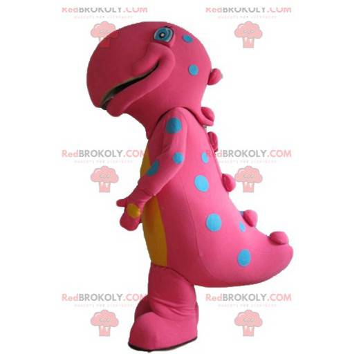 Grande mascote de dinossauro rosa e amarelo com pontos azuis -