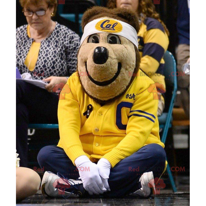 Brown bear mascot in yellow and blue sportswear - Redbrokoly.com