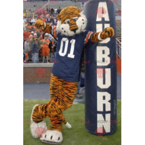Mascote tigre laranja e preto com uma camisa azul -