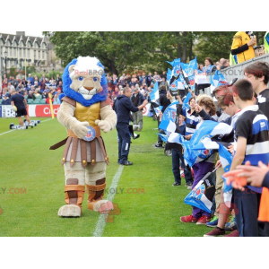 Mascotte de lion musclé habillé en chevalier - Redbrokoly.com