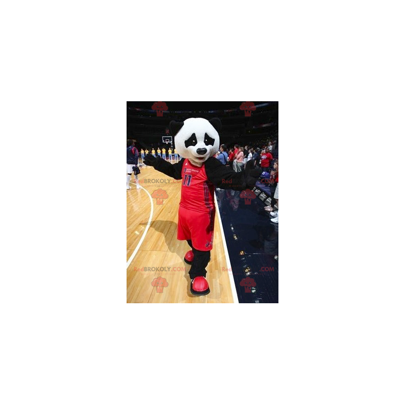 Mascotte de panda noir et blanc en tenue de sport -