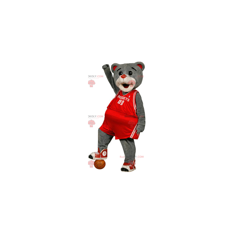 Szary niedźwiedź maskotka w czerwonej odzieży sportowej -