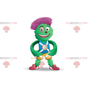 Green and red artichoke mascot in blue and yellow outfit -