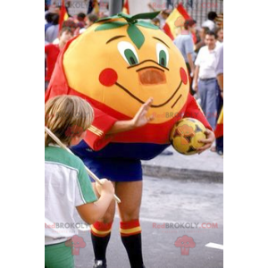 Mascotte arancione mandarino gigante in abbigliamento sportivo