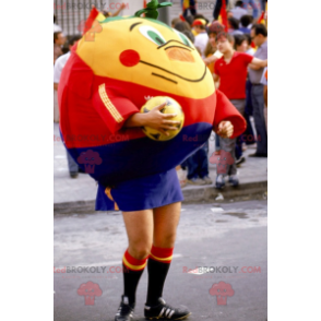 Mascota naranja mandarina gigante en ropa deportiva -