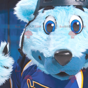 Mascote urso azul com olhos azuis em roupas esportivas -
