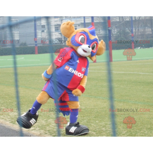 2 mascottes: een gele beer en een blauw en rood gemaskerd dier