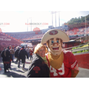 Mascotte del cowboy muscoloso e sorridente - Redbrokoly.com