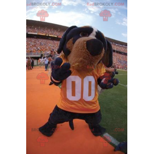 Black and brown dog mascot with a yellow t-shirt -