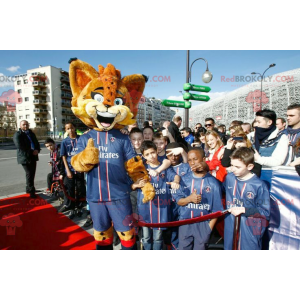 Mascotte lince arancione con gli occhi azzurri - Redbrokoly.com