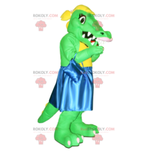 Grünes und gelbes Krokodilmaskottchen mit einem blauen Kleid -